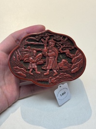 A fine Chinese red cinnabar lacquer ruyi-form 'Ba Man Xian Bao 八蠻獻寶' box and cover, Qianlong