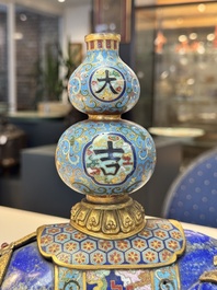 A Chinese lapis lazuli and cloisonn&eacute; elephant on stand, 19/20th C.