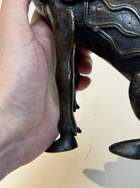 A fine Chinese bronze incense holder in the form of a qilin, Ming