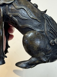 A fine Chinese bronze incense holder in the form of a qilin, Ming