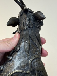 A fine Chinese bronze incense holder in the form of a qilin, Ming