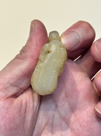 A Chinese white and russet jade pendant in the form of a horse, Song/Ming