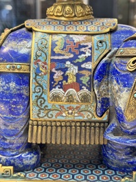 A Chinese lapis lazuli and cloisonn&eacute; elephant on stand, 19/20th C.