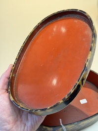 A fine and rare Chinese tortoiseshell-veneered and red-lacquered oval box and cover, signed Wang Wenzhi 王文治, Qianlong mark and of the period
