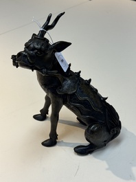 A fine Chinese bronze incense holder in the form of a qilin, Ming