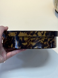 A fine and rare Chinese tortoiseshell-veneered and red-lacquered oval box and cover, signed Wang Wenzhi 王文治, Qianlong mark and of the period