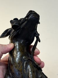 A fine Chinese bronze incense holder in the form of a qilin, Ming