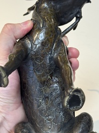 A fine Chinese bronze incense holder in the form of a qilin, Ming