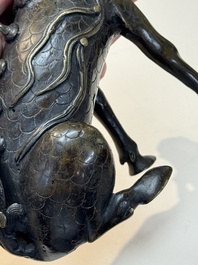 A fine Chinese bronze incense holder in the form of a qilin, Ming