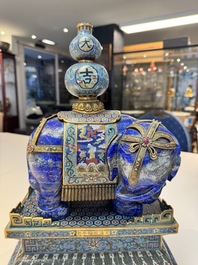 A Chinese lapis lazuli and cloisonn&eacute; elephant on stand, 19/20th C.
