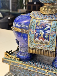 A Chinese lapis lazuli and cloisonn&eacute; elephant on stand, 19/20th C.