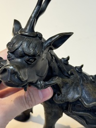 A fine Chinese bronze incense holder in the form of a qilin, Ming