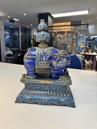 A Chinese lapis lazuli and cloisonn&eacute; elephant on stand, 19/20th C.