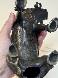 A fine Chinese bronze incense holder in the form of a qilin, Ming