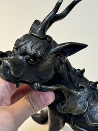 A fine Chinese bronze incense holder in the form of a qilin, Ming