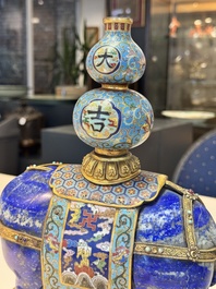 A Chinese lapis lazuli and cloisonn&eacute; elephant on stand, 19/20th C.