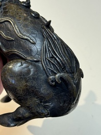 A fine Chinese bronze incense holder in the form of a qilin, Ming