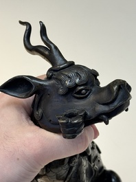 A fine Chinese bronze incense holder in the form of a qilin, Ming