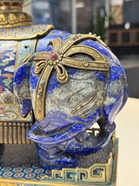 A Chinese lapis lazuli and cloisonn&eacute; elephant on stand, 19/20th C.