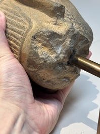 A Khmer Angkor Wat-style sandstone head of Shiva, probably 12th C.