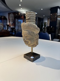 A Khmer Angkor Wat-style sandstone head of Shiva, probably 12th C.