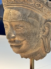 A Khmer Angkor Wat-style sandstone head of Shiva, probably 12th C.
