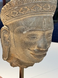 A Khmer Angkor Wat-style sandstone head of Shiva, probably 12th C.