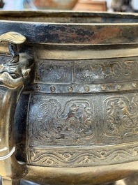 A Chinese archaistic bronze censer with 'chilong' and 'lingzhi' handles on wooden stand, Zhou Wang Bo Zuo Bao Ding 周王伯作寶鼎 mark, Yuan/Ming