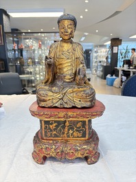 A set of three Chinese or Vietnamese gilt-lacquered wooden sculptures of Buddha, 18/19th C.