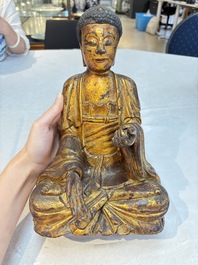 A set of three Chinese or Vietnamese gilt-lacquered wooden sculptures of Buddha, 18/19th C.