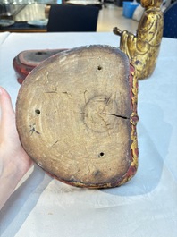 A set of three Chinese or Vietnamese gilt-lacquered wooden sculptures of Buddha, 18/19th C.