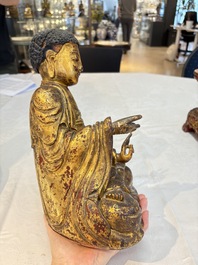 A set of three Chinese or Vietnamese gilt-lacquered wooden sculptures of Buddha, 18/19th C.