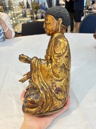 A set of three Chinese or Vietnamese gilt-lacquered wooden sculptures of Buddha, 18/19th C.