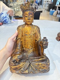 A set of three Chinese or Vietnamese gilt-lacquered wooden sculptures of Buddha, 18/19th C.