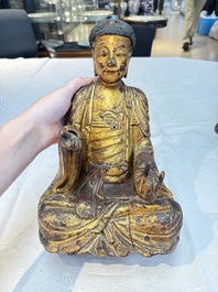 A set of three Chinese or Vietnamese gilt-lacquered wooden sculptures of Buddha, 18/19th C.