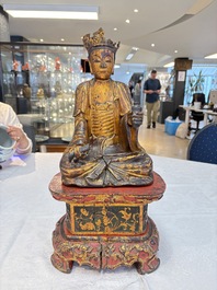 A set of three Chinese or Vietnamese gilt-lacquered wooden sculptures of Buddha, 18/19th C.