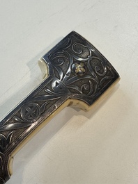 A Caucasian walrus bone-hilted kindjal with niello silver mounts, 19th C.