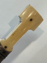 A Caucasian walrus bone-hilted kindjal with niello silver mounts, 19th C.