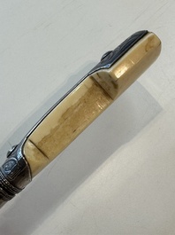 A Caucasian walrus bone-hilted kindjal with niello silver mounts, 19th C.