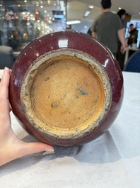 A large Chinese flamb&eacute;-glazed 'yuhuchunping' vase on a wooden stand, 19th C.