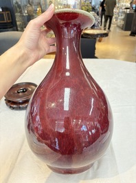 A large Chinese flamb&eacute;-glazed 'yuhuchunping' vase on a wooden stand, 19th C.