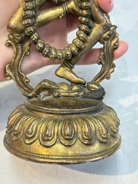 A Nepalese or Tibetan turquoise-inlaid gilt-bronze sculpture of Kurukulla or Red Tara, 15th C. or later