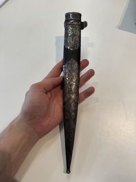 A Caucasian walrus bone-hilted kindjal with niello silver mounts, 19th C.