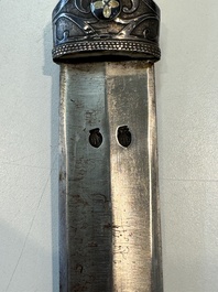 A Caucasian walrus bone-hilted kindjal with niello silver mounts, 19th C.