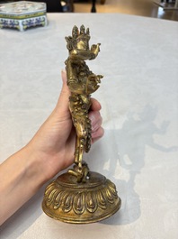 A Nepalese or Tibetan turquoise-inlaid gilt-bronze sculpture of Kurukulla or Red Tara, 15th C. or later