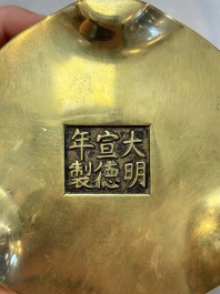 A Chinese bronze cylindrical tripod censer, Xuande mark, 18th C.