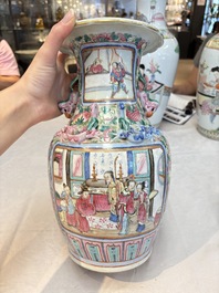 A pair of Chinese famille rose vases with narrative design on wooden stands, 19th C.