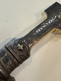 A Caucasian walrus bone-hilted kindjal with niello silver mounts, 19th C.