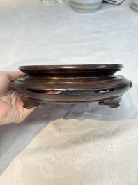 A pair of Chinese famille rose vases with narrative design on wooden stands, 19th C.