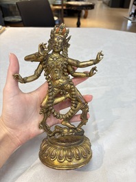 A Nepalese or Tibetan turquoise-inlaid gilt-bronze sculpture of Kurukulla or Red Tara, 15th C. or later